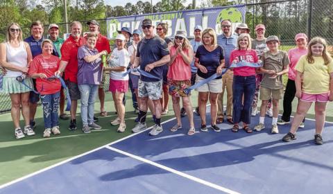 Smiles and applause were all around last Friday as a ribbon cutting was held for the additional pickleball courts at the Morris Bank Recreation Complex. BRAD HARRISON/Staff