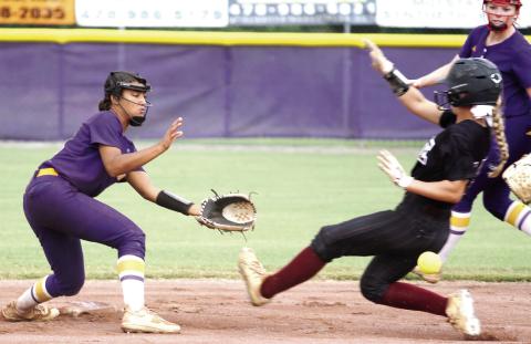Myah Briscoe gets into position to make the tag against the Trojans. BRAD HARRISON/Staff