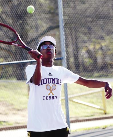 Fred Ogletree volleys the ball toward the opposite side of the court against Dutchtown. BRAD HARRISON/Staff