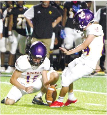 Brendan Waters gets the Greyhounds on the board with a first-half field goal against Peach County.  BRAD HARRISON/Staff