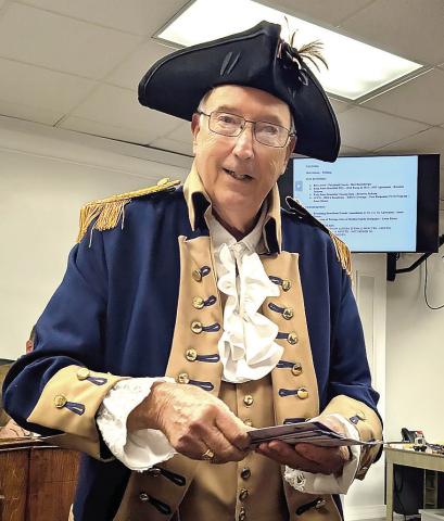 John Trussell, in Revolutionary War attire, visited commissioners and city council in December. FLE PHOTO
