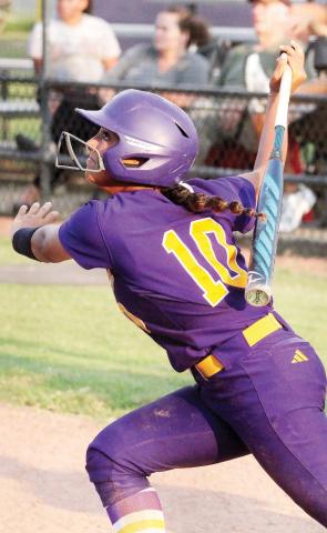 Myah Briscoe rips the ball into play against the Wolverines. BRAD HARRISON/Staff