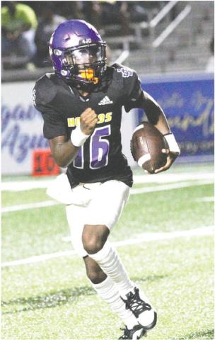 Greyhounds quarterback Devin Edmonds scrambles away from the pocket in the third quarter against Peach County. BRAD HARRISON/Staff
