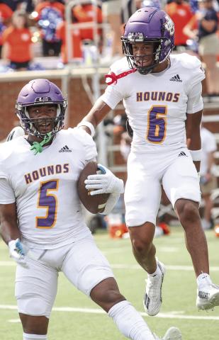 Zacari Thomas, left, celebrates after coming up with a turnover last season. BRAD HARRISON/Staff