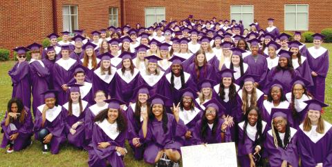 Jones County High School Class of 2023 gather in front of Gray Station Middle School before visiting inside the school during the May 12 Grad Walk. CONTRIBUTED