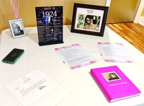 Collins received a letter from Governor Brian Kemp, which was displayed on a table with mommentos from the past 100 years. ALAINA CLARKE/Staff