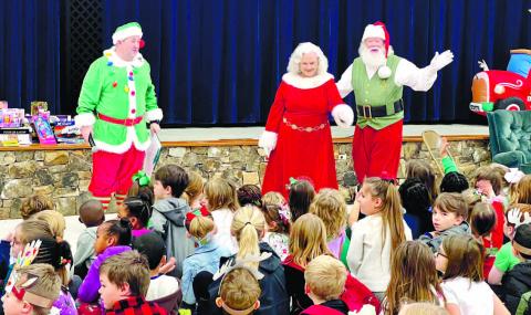 Santa and Mrs. Claus making an appearance at Turner Woods Elementary School for the Christmas celebration.