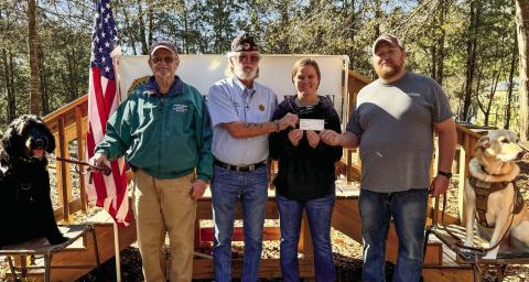 Legion Commandant Russell Curry (center left) presents a check to Holly and Jeramie Frasure for the benefit of Bellablue Farm and their work training service dogs for veterans. CONTRIBUTED