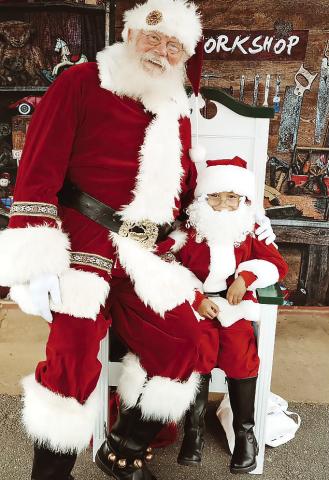 Santa and his mini-me, Michael Kuehl, at Gray’s Hometown Christmas Market are wishing everyone a Merry Christmas. Little Santa’s parents are Amy Young Kuehl and Bill Kuehl, and Michael’s Santa suit was made by his grandmother, Alethea Young. Photo contributed by Kayla Faith Photo