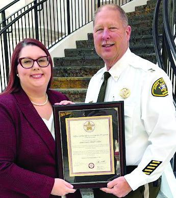 Administrative Coordinator Brittany Marks and Capt. Shane Moody with the certification plaque. CONTRIBUTED