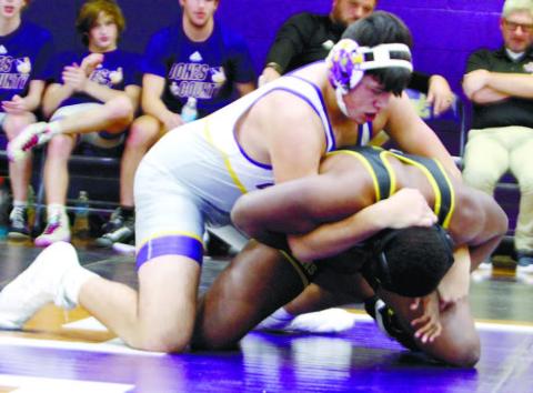 Garrett Green gains leverage against his opponent from East Laurens on Saturday. BRAD HARRISON/Staff