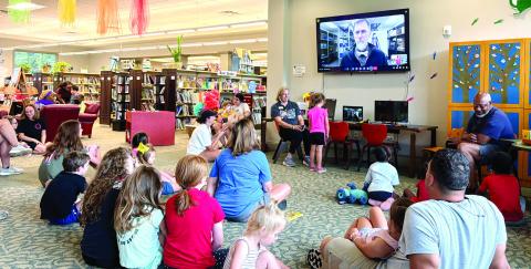 Steven Smith with NASA visits the Jones County Library via Zoom from Johnson Space Center in Houston June 17 and interacts with students with questions as part of the focus on space. The GCSU Star Lab is on the other side of the room. DEBBIE LURIE-SMITH/Staff