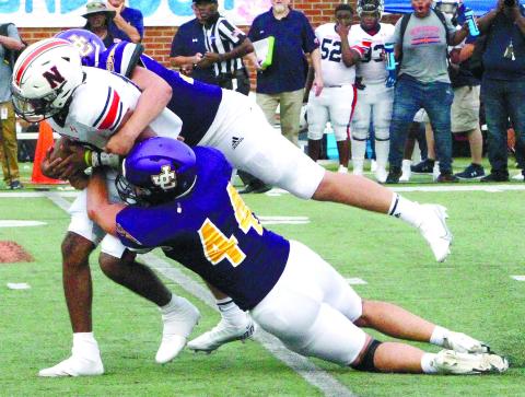 Led in part by Chandler Harris, (44) the Greyhounds held Northside to just one second-half touchdown on Saturday. BRAD HARRISON/Staff