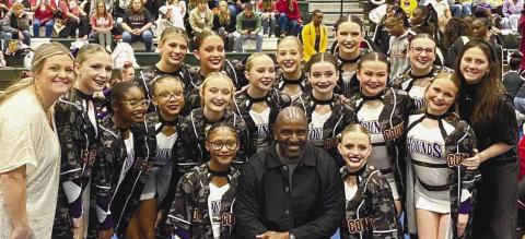 Jones County’s Competition Cheerleaders pose with JCHS Principal Dennis Woofolk after Saturday’s runner-up finish in the region that qualified them for Friday’s GHSA state championships. CONTRIBUTED