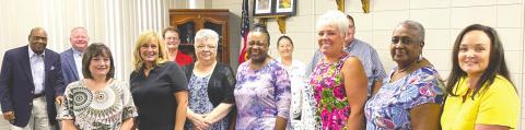 Jones County School System bookkeepers are recognized by Board of Education members at a June 21 public hearing and called meeting. DEBBIE LURIE-SMITH/Staff