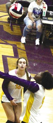 Nya Warren (foreground) keeps the volley going during last week’s win against Warner Robins.  BRAD HARRISON/Staff 