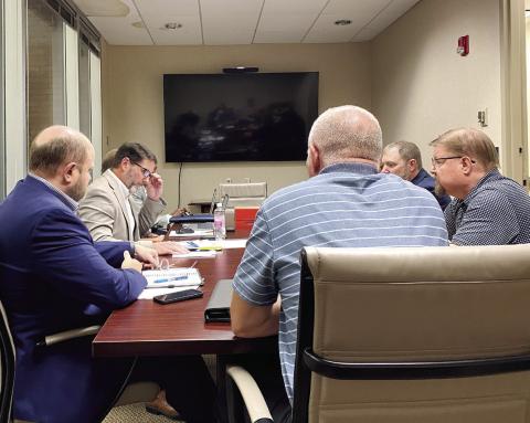 Arbiters listen to arguments of both sides at the Nov. 6 arbitration held Nov. 6 at the Bibb County Tax Assessors Office. DEBBIE LURIE-SMITH/Staff