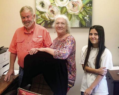Fran and her adopted daughter Natalie join Bart Jackson in his former courthouse office, where he served as Superior Court Clerk. CONTRIBUTED