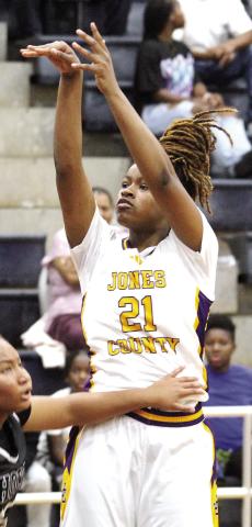 Liberty Pennamon follows through after draining a jump shot against the Bears. BRAD HARRISON/Staff