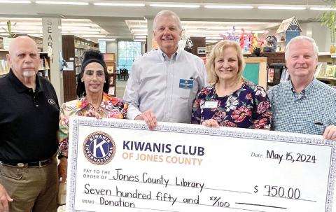 Members of the Jones County Kiwanis Club presented Jones County Library Branch Manager Julie King (second from right) with a check in the amount of $750 May 15. King thanked the Kiwanis Club for blessing the children of Jones County through their continued support of the library. CONTRIBUTED