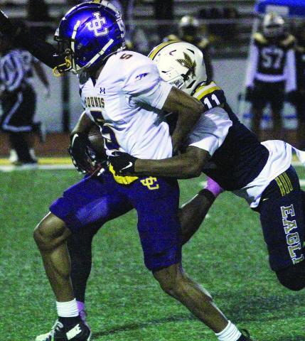 JR Clark breaks an Eagles Landing tackle during the first quarter on Friday. BRAD HARRISON/Staff
