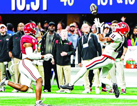 Georgia wide receiver Arian Smith (11) got into the action during the SEC Championship game against Alabama on a 51-yard reception. CHARLES JORDAN/Staff