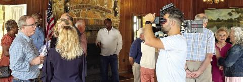 John T. Edge (2nd left) greeting friends at the Jonesco Club House April 29, including some he had not seen in more than 30 years. DEBBIE LURIE-SMITH/Staff