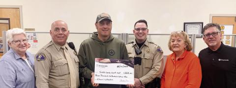 Members of Woodmen Life present check for $3,618 to the Jones County Sheriff’s Office March 6 to cover the cost of two tasers and holsters. CONTRIBUTED