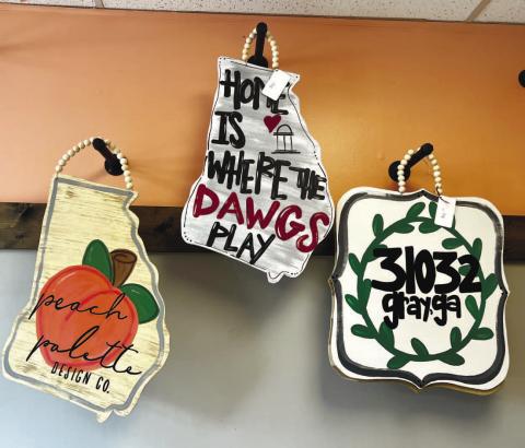 Peach Palette Design Co. has many different door hangers available for purchase or to paint.