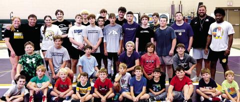 Current and future wrestlers receive high-level instruction during camp