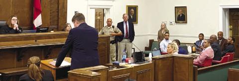 District Attorney T. Wright Barksdale (at podium) speaks to the court during the murder trial against three defendants for the 2017 death of Marquis Hardwick. Presiding over the trial is Superior Court Alison Burleson (far left). DEBBIE LURIE-SMITH/Staff