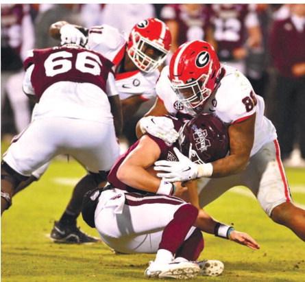 Georgia defensive linemen Jalen Carter (88) sacks Mississippi State quarterback Will Rogers during Saturday’s game in Starkville, Miss. ROB DAVIS/UGA Athletics