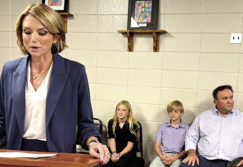 Dr. Jessica Graves speaks at the Nov. 20 meeting, with her family seated behind her, after the vote appointing her superintendent. DEBBIE LURIESMITH/Staff