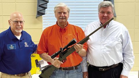 Richard Latham (center) won a Ruger hunting rifle in the Kiwanis Club annual raffle. He is pictured with Kiwanians Bob Lazenby (left) and Scott Walston. CONTRIBUTED