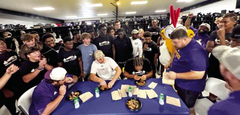 The Greyhounds wrapped up the final week of the preseason with some competition in the form of consumption. Thursday night, Jones County players and coaches cheered on four of their own in a wingeating contest of wings from Zaxby’s in Gray. Assistant coach Ryan Stewart, the Greyhounds’ recruiting coordinator, took the honors this year after offensive line coach River Vaughn took the title a year ago. Photos by BRAD HARRISON / Staff