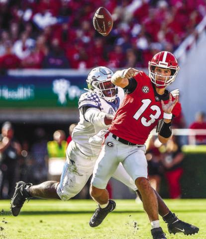 Quarterback Stetson Bennett went 14-20 passing in 2021 against Kentucky for 250 yards and three touchdowns with no interceptions for an average of 12.5 yards per play. He also rushed three times for 22 yards. MACKENZIE MILES/ UGA Athletics
