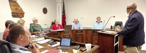 Jones County School System Clinton Burston introduces himself to Board of Commissioner members at their July 1 meeting. DEBBIE LURIE-SMITH/Staff