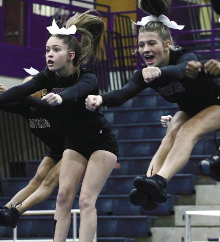 Cheerleaders from the high school, middle school and elementary levels took the floor during last week’s friends &amp; family night. BRAD HARRISON/Staff