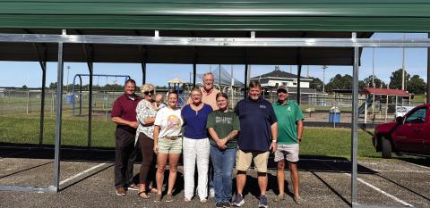 The pavilion was dedicated by Sonrise Ministries founder Ronnie Hinson (back row, center) and a group of supporters. DEBBIE LURIE-SMITH/Staff