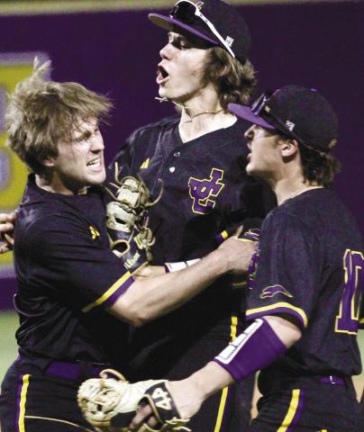 Brody Gordon, left, celebrates with his teammates after getting three strikeouts to close out Friday’s win. BRAD HARRISON/Staff