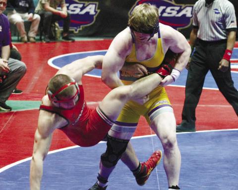 Chi Anderson executes a leg takedown near the start of Friday’s third-place match. BRAD HARRISON/Staff