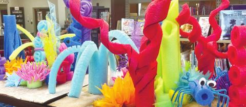 Ocean themed displays, such as this coral display made of pool noodles, was made by the library staff. ALAINA CLARKE/Staff