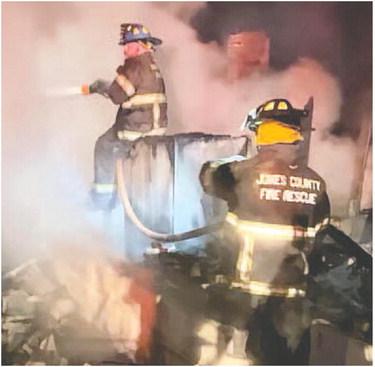 Jones County Firefighters battle the Dec. 26 blaze at a home on Hungerford Road. The fire is believed to have started in the fireplace of the house, which was total loss. CONTRIBUTED