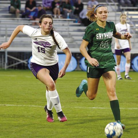 Kaylee Pippin runs the ball down from behind on Thursday against Ace Charter. BRAD HARRISON/Staff