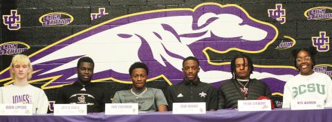 From left, Aiden Lipford, Jaylen Dekle, Rod Freeman, Zion Ragins, Tyler Stewart, and Nya Warren pose after signing their letters of intent last Wednesday at JCHS. BRAD HARRISON/Staff