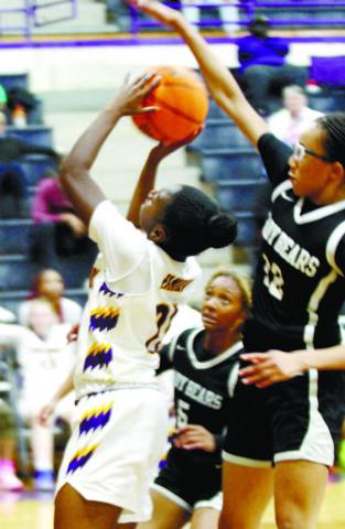 Yariah Webb fights off the Lady Bears as she drives to the basket late in Friday’s win. BRAD HARRISON/Staff