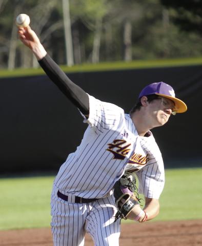 Starting pitcher Cason Taylor delivers a pitch last Tuesday against Ola. BRAD HARRISON/Staff