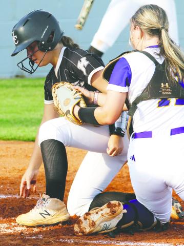 Allie Miller applies the tag to get the out at home against the Bears. BRAD HARRISON/Staff