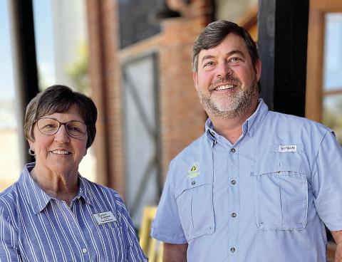 Carol Robeson and Henry Hicks, the owners of Forsyth Antiques and More, outside of their business. CONTRIBUTED