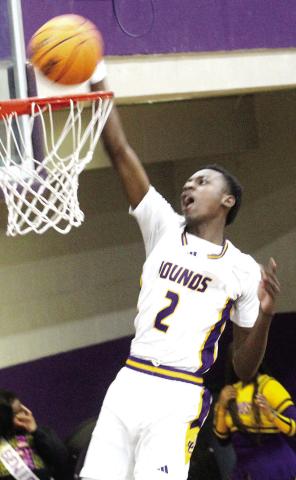 Rudy Bowden slams the ball in for a dunk against the Chargers. BRAD HARRISON/Staff